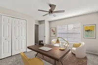 Chic home office with a sleek wooden desk, modern decor, and abundant natural light.