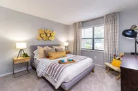 Chic and cozy bedroom with modern decor, plush bedding, and warm lighting, perfect for relaxation and comfort.