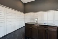 Modern apartment parcel locker area with sleek cabinetry and secure package delivery system.
