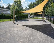 Pet-Friendly Apartments in West Chester, PA - Audubon Pointe - Dog Park with Shaded Spots, Multiple Play Areas, and Benches