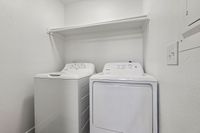 Modern laundry room featuring sleek washer and dryer appliances, perfect for efficient home living.