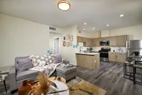 living space with connected kitchen