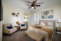 large bedroom with seating area