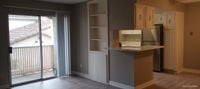 living space with large sliding glass doors