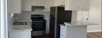 living space with connected kitchen