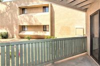 patio-balcony with green fencing at Silver Creek Apartments