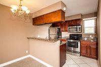 kitchen with breakfast bar and stainless steel appliances at Solaris at The Biltmore