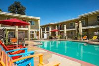 pool with colorful chairs and lounge chairs at Solaris at The Biltmore