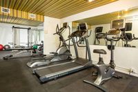 community fitness center with treadmill and stationery bikes at Solaris at The Biltmore