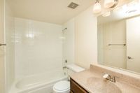 full bath with shower tub combo and beige vanity at Bridge Lane
