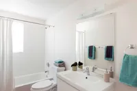 full bath with shower tub combo and white vanity at Oasis 20