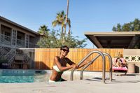 woman climbing out of pool at oasis 20
