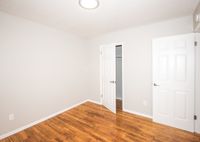 bedroom with closet and wood flooring