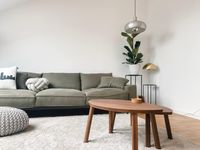 living room with green couch