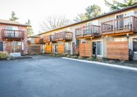 ample parking with lush landscaping
