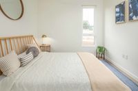 furnished rendering of bedroom with bed and side table at twelve mile crossing