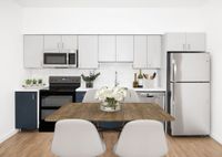 rendering of kitchen with 4 person dining table and Wood-Style Flooring at Twelve Mile Crossing
