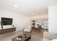 rendering of Living and dining room with Wood-Style Flooring at Twelve Mile Crossing