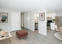 virtually staged living room with vinyl wood like flooring with coffee table at 81 powell apartments