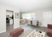 virtually staged living room with vinyl wood like flooring with coffee table at 81 powell apartments