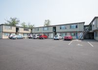 two story apartment buildings with stairs to second floor and parking at 81 powell