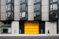 the oro apartment building with yellow garage door