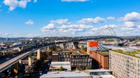 views of city from the rooftop terrace at oro apartments