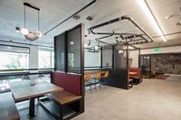 the mezz-semi private booths and sitting area with kitchen at oro apartments
