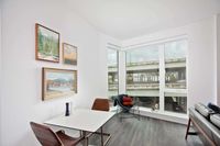 Downtown Portland Apartments - ORO - Dining Nook with Floor to Ceiling Windows and Wood-Style Flooring