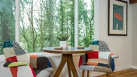 trendy lounge seats with a peaceful view of the woods