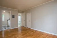 large living room that opens to the vintage style kitchen and bathroom