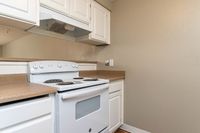 Kitchen with White Appliances and Cabinets