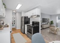 Kitchen with stainless-steel appliances and beautiful wood flooring