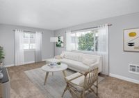 Living room with large windows allowing for abundant natural light