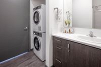bathroom and stacked laundry at Parallax apartments
