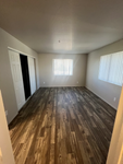 bedroom with two windows and full closet and storage