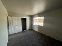 Bedroom with full size closet and window