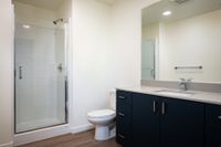 Bathroom with shower, sink, and toilet