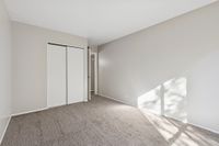 Bedroom with closed closet and carpet