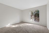 Living Area with large window and carpet