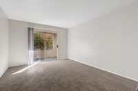 Living area with carpet and patio view