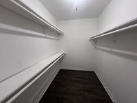 Organized and spacious wardrobe space Memorial Fountain Apartment Closet | Apartments in Houston, TX
