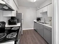 Sunlit kitchen with stylish finishes Memorial Fountain Apartment Kitchen | Apartments in Houston, TX