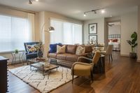 Warm tones and inviting furnishings create a welcoming vibe Pearl Residences at City Centre Apartment Living Room | Houston, TX Apartments | Houston CityCentre Apartments