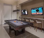 Sleek and inviting billiards space.