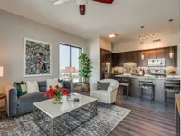 Open space with functional zones. The McCarthy at Memorial City Living Room | Houston, TX Apartments | Apartments in Houston, TX