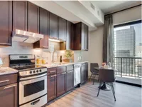Seamless kitchen and dining integration. The McCarthy at Memorial City | Houston, TX Apartments | Apartments in Houston, TX