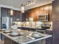 Seamlessly connected cooking and dining space. The McCarthy at Memorial City | Houston, TX Apartments | Apartments in Houston, TX
