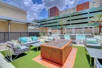 Stylish seating just steps from the water. The McCarthy at Memorial City Pool| Houston, TX Apartments | Apartments in Houston, TX