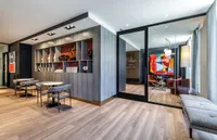 Elegant lounge area with modern decor, stylish seating, and vibrant artwork.